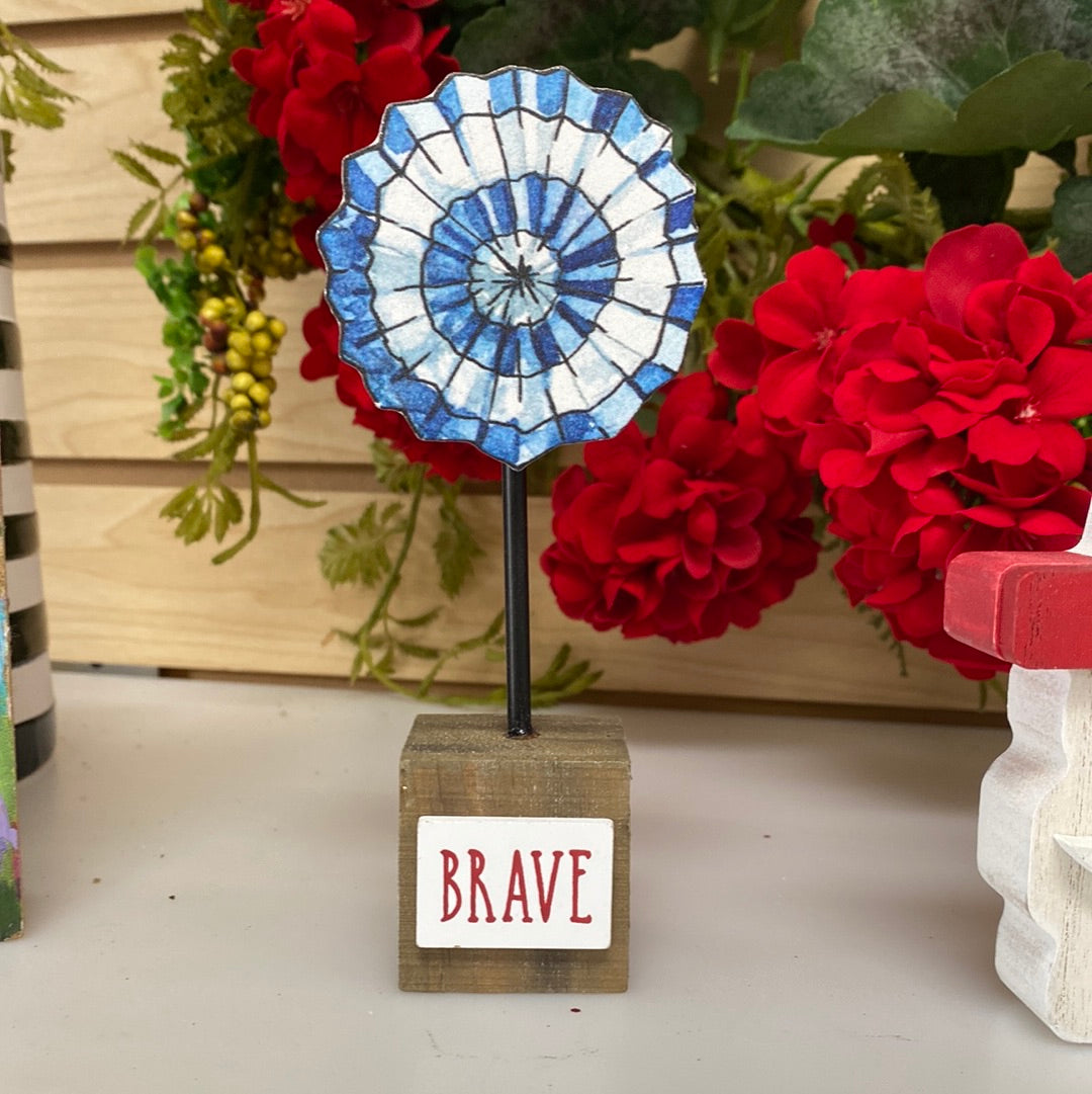 Blue white pinwheel on base