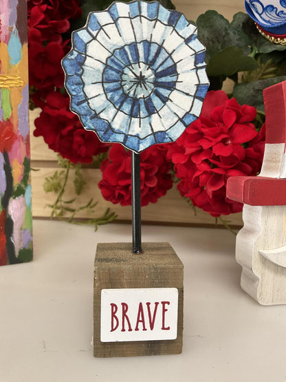 Blue white pinwheel on base