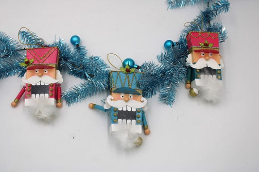 Metal nutcracker ornament, pink teal