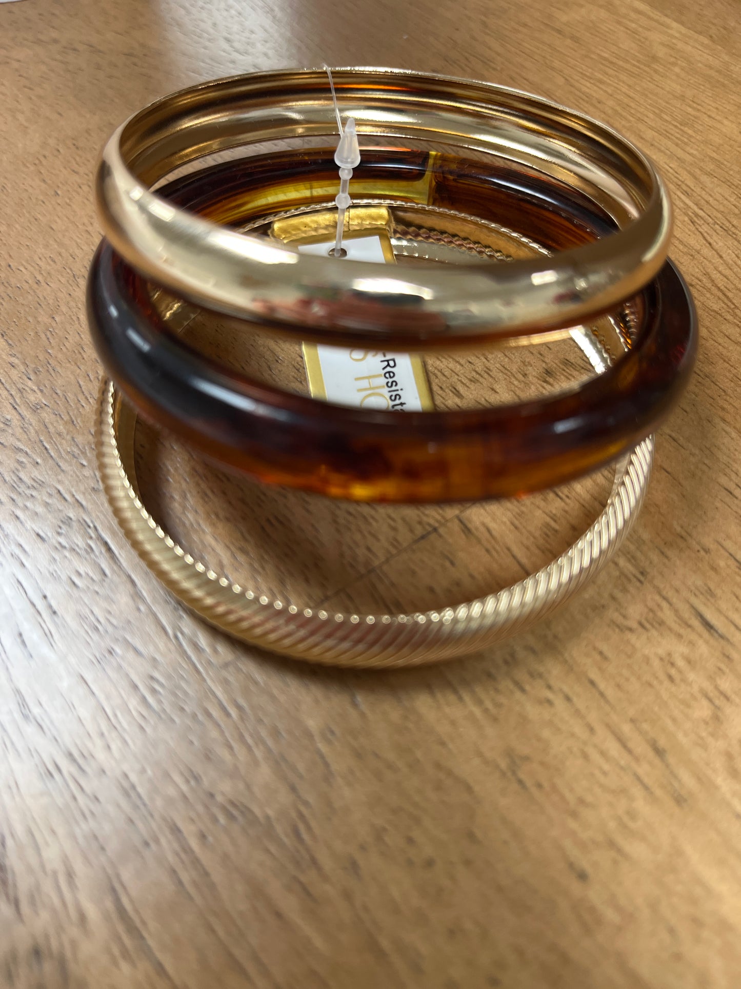 Water resistant set of 3 acrylic gold and brown bangles