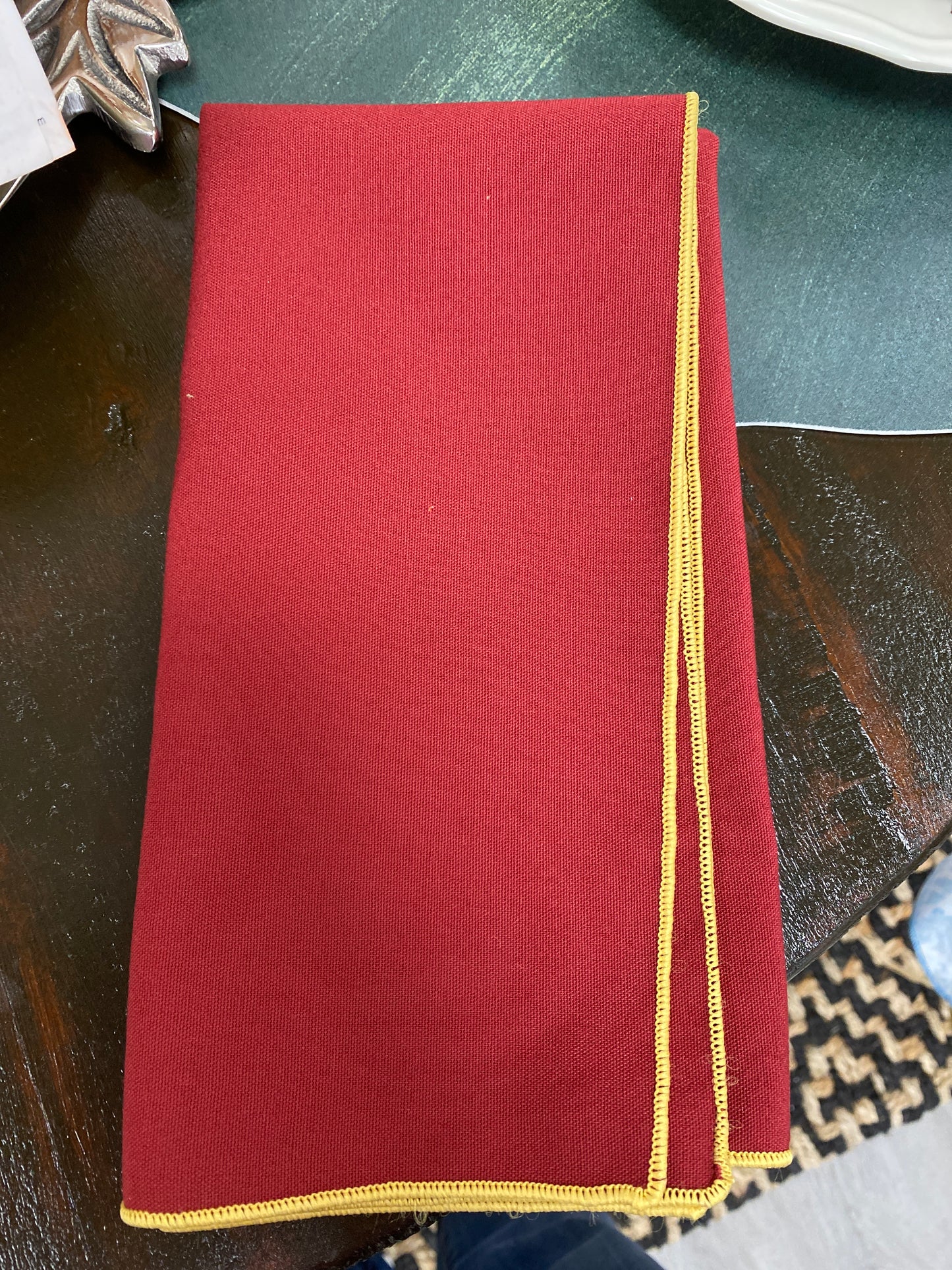 Burgundy with gold trim napkin