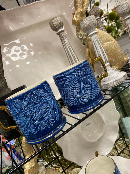 Blue and white mug with gold handle