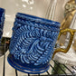 Blue and white mug with gold handle