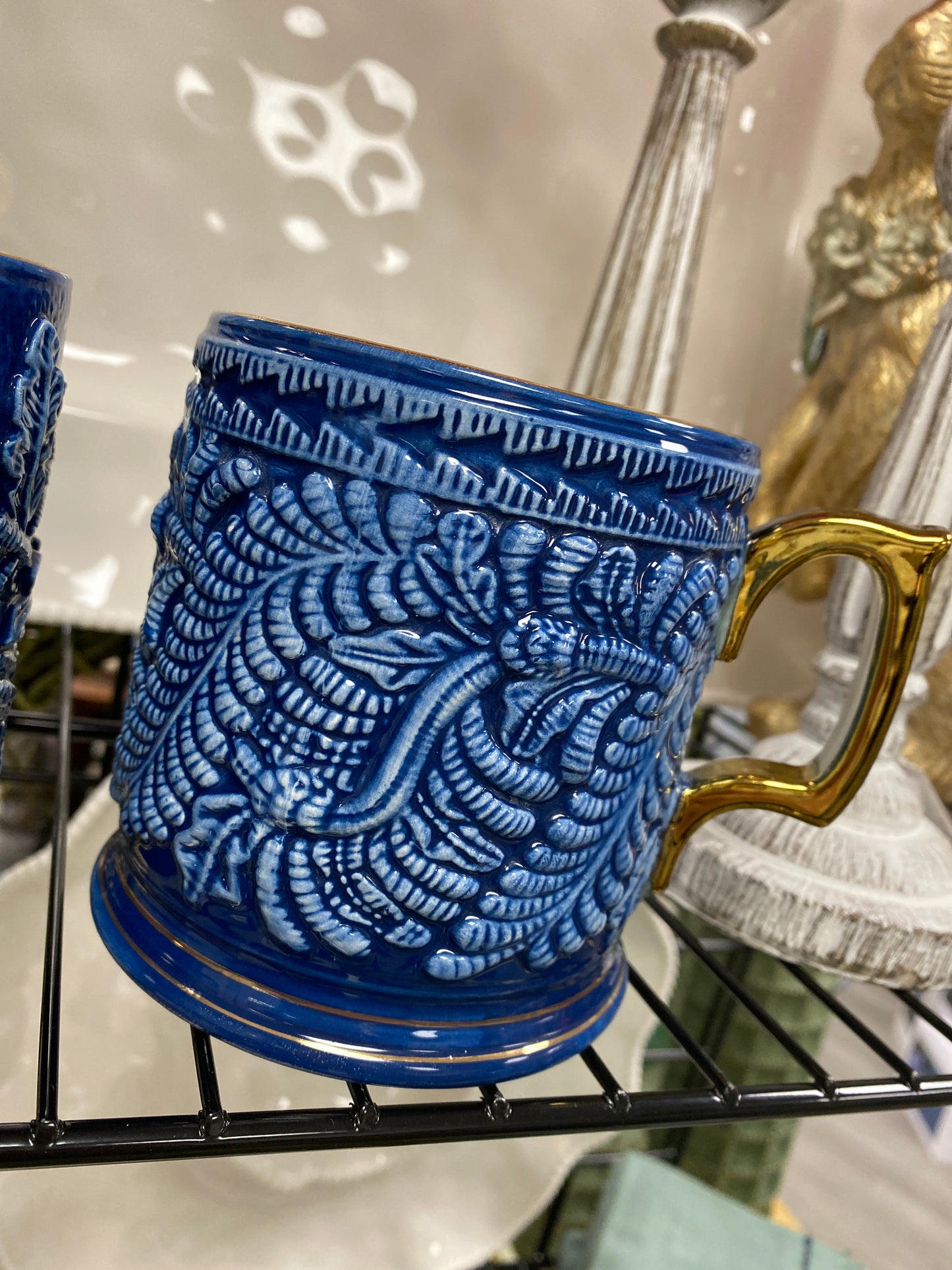 Blue and white mug with gold handle