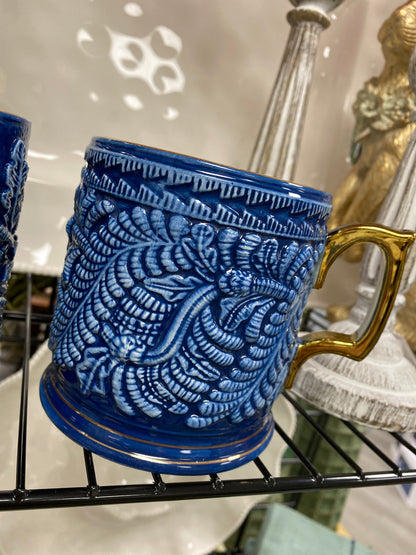 Blue and white mug with gold handle