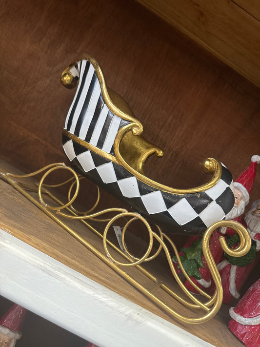 Resin gold gilded black and white harlequin sleigh