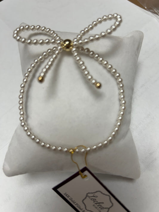 Pearl Bow Bracelet with Gold Accents
