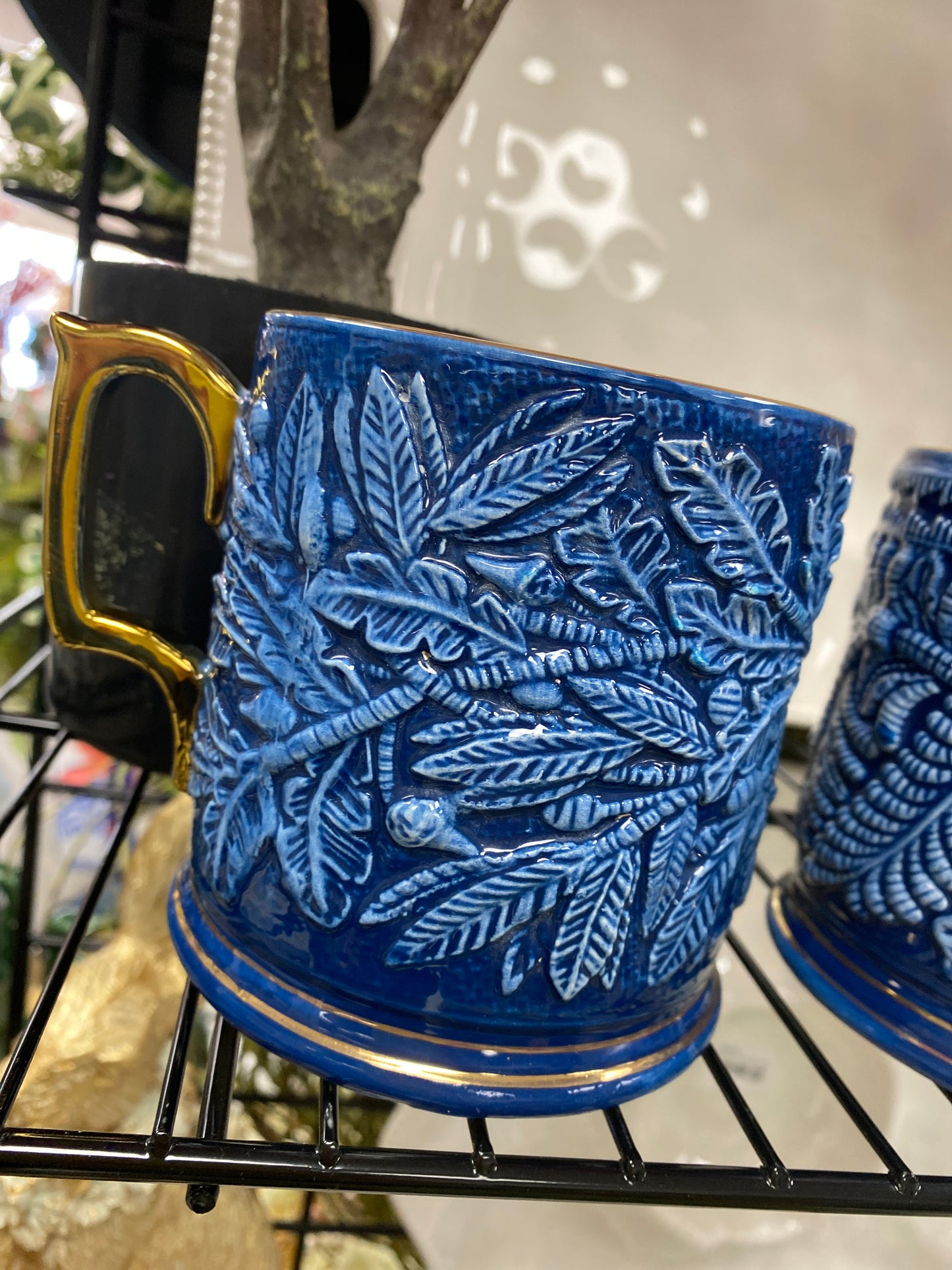 Blue and white mug with gold handle