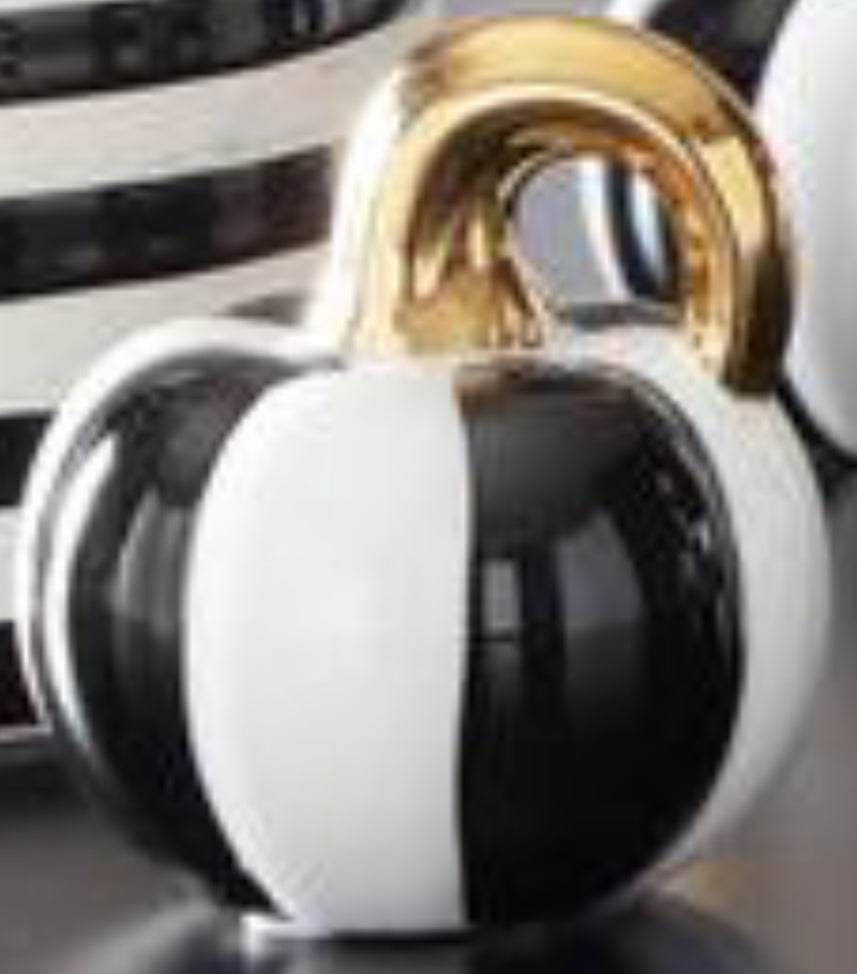 White and black striped ceramic pumpkin with gold stem