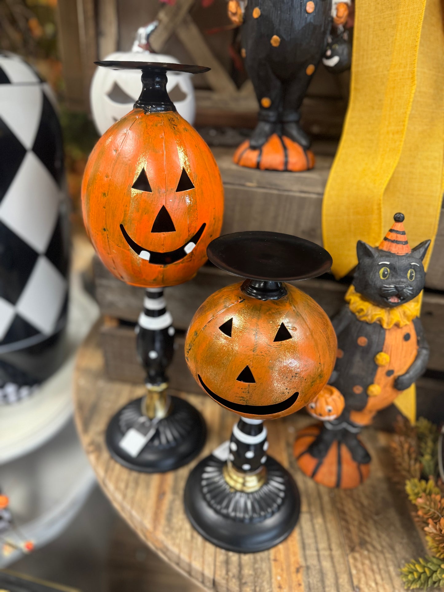 Jack o lantern candleholder on black and white spindle base