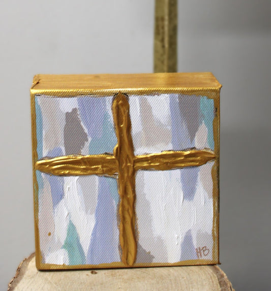 Hand painted canvas gold cross on pale blue