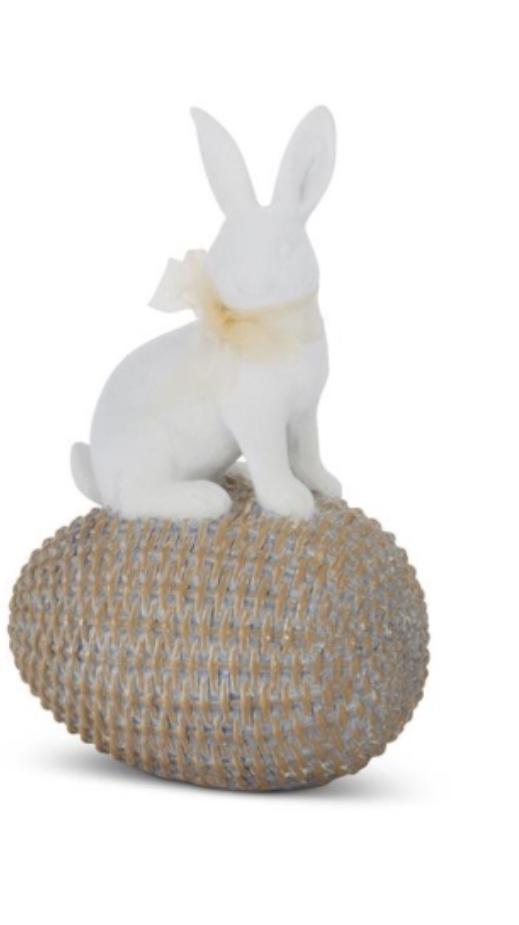 white resin easter bunnies on woven eggs