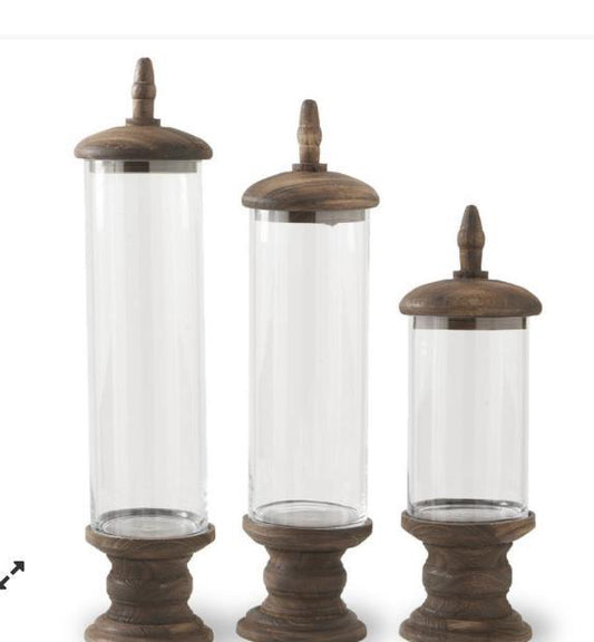 Glass cylinder containers with brown wood base and pedestal top